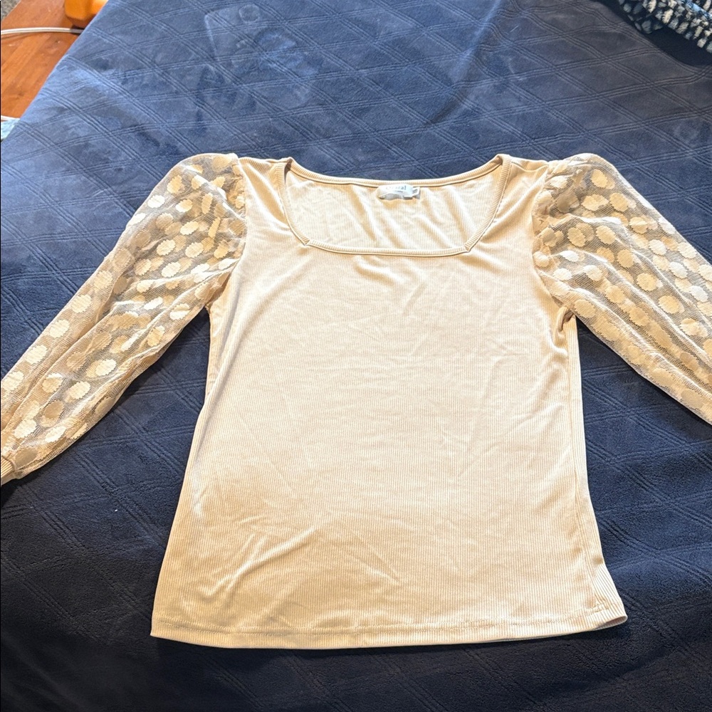 Elegant Cream Top with Sheer Polka Dot Sleeves